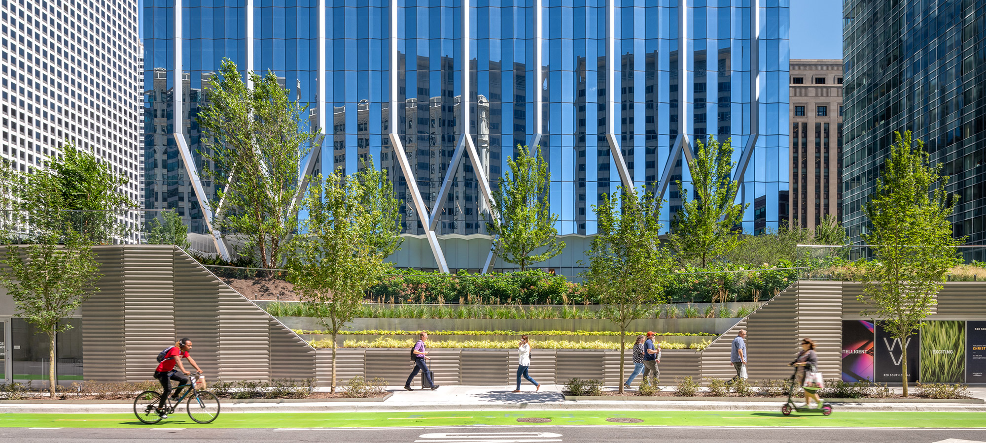 Street view of a buildings architecturally-modern glass facade