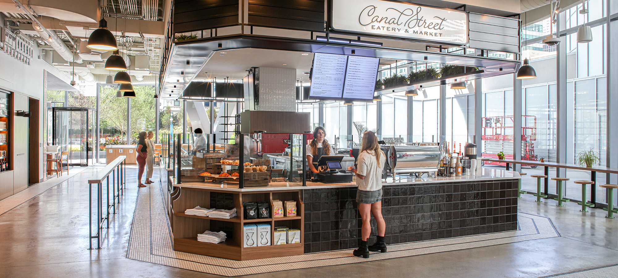 People ordering food at The Canal Street Eatery & Market